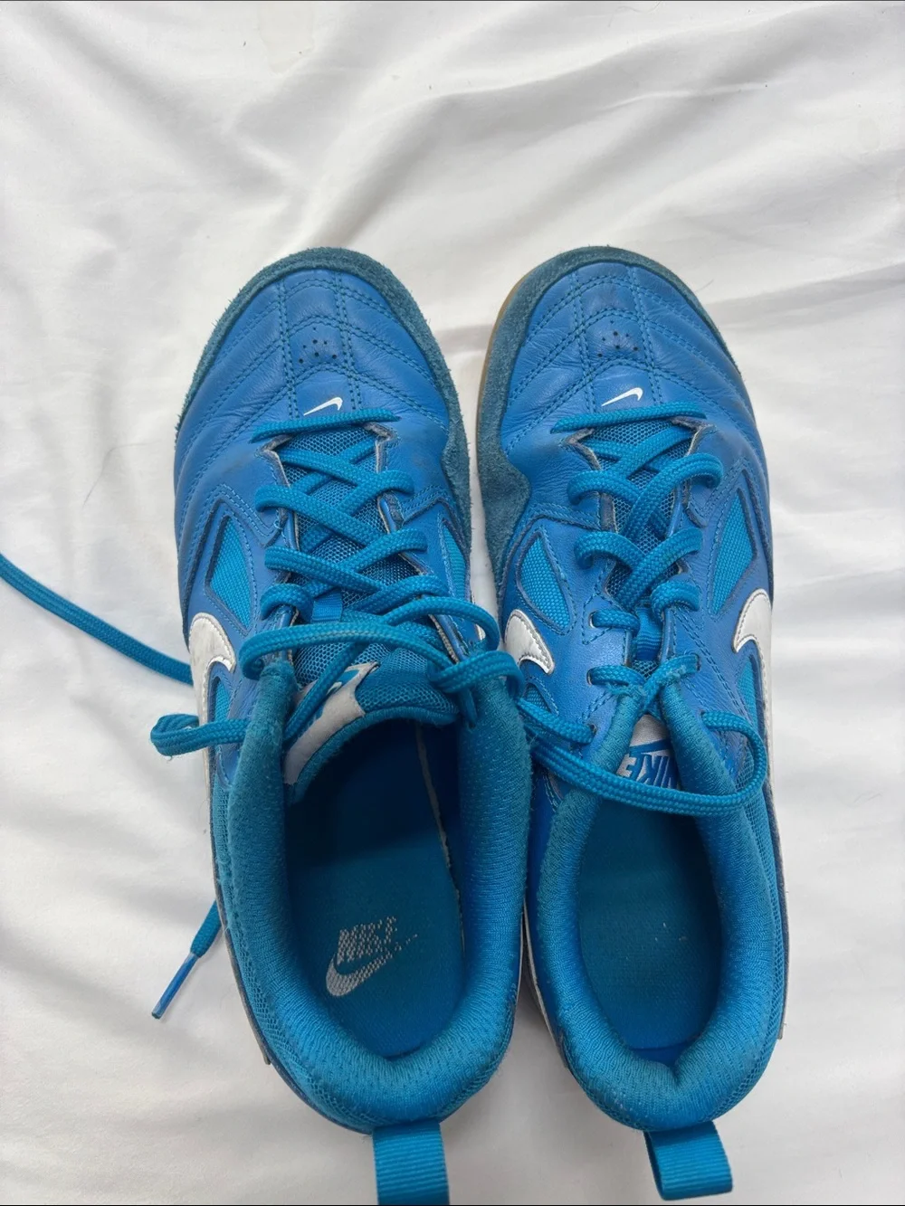 Nike Teal-Blue Athletic Sneakers with White Swoosh.   Used for indoor soccer